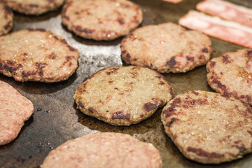 eight well roasted hamburger meat, on an iron
