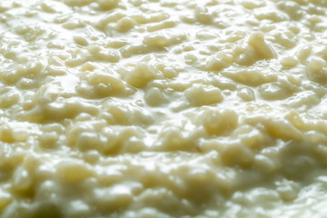 close-up photograph of rice pudding with backlight and shadows