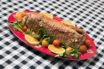 Christmas stuffed turkey in Colombia with cherry tomato and lemon
