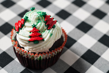 close-up photograph of Christmas cupcake on checkered cloth