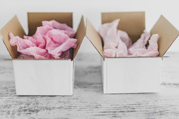 competition concept, delivery parcel boxes side by side with slightly different colors symbol of...