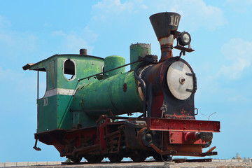 Fototapeta premium Unused old rusty antique green steam train locomotive