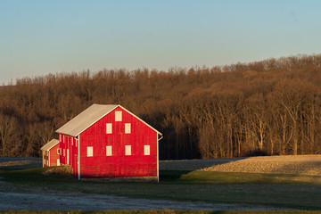 Red Barns and Farm Fields in a Winter Sunset