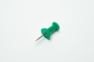 Close up of Green pin  on white background