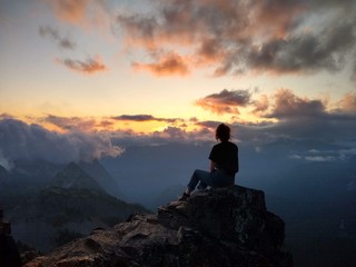 girl on mountain at sunset
