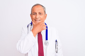 Senior grey-haired doctor man wearing stethoscope standing over isolated white background looking confident at the camera smiling with crossed arms and hand raised on chin. Thinking positive.