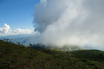 Panoramic view of beautiful mountain landscape in Doi Pui Luang with green mountain pastures with cloud and sun lights. Mae Ngao National park in north of Thailand.