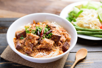 Northern Thai food (Kanom Jeen Nam Ngeaw), rice noodles with spicy soup eating with vegetables