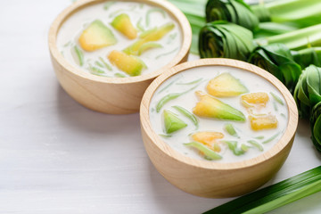 Thai dessert (Lod Chong), rice flour pandan flavor and sliced melon fruit in coconut milk