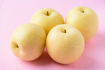 Fresh Asian pear fruit on pink background