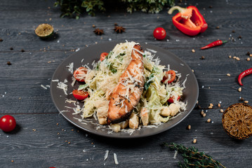 caesar salad with roasted salmon close up food for restaurant menu