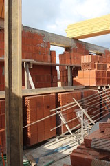 Fototapeta na wymiar construction site for work in a brick multi-storey building under construction new residential building