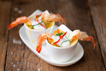 Steamed Seafood Curry Cakes with coconut cream and Prawn.