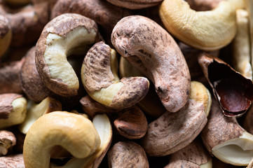Roasted cashews on natural wooden table background