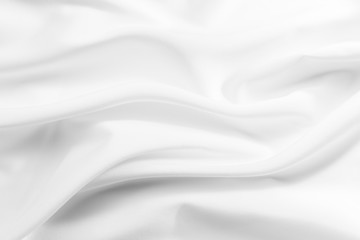 Fototapeta premium Abstract white fabric texture background. Cloth soft wave. Creases of satin, silk, and cotton.