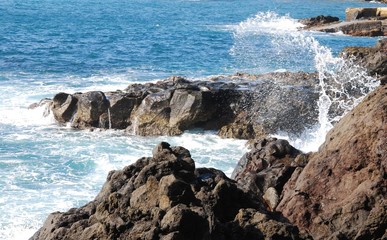 waves crashing on rocks