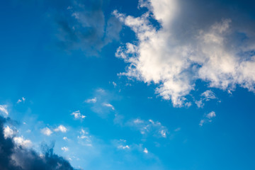 Blue  sky with black clouds. Blue sky with white clouds