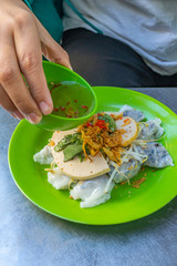 Vietnamese popular street food, Banh Cuon served with chili sauce