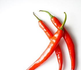 Top view of red hot chili pepper over white background.