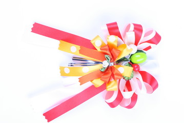 Decorative red & yellow color ribbon bow on white background