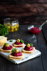 Beetroot relish on crackers. An original party snack.