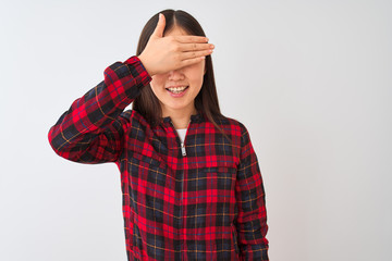 Young chinese woman wearing casual jacket standing over isolated white background smiling and laughing with hand on face covering eyes for surprise. Blind concept.