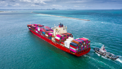Container ship carrying container for business logistic freight import and export, Aerial view...