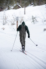 Fototapeta na wymiar snowboarder enjoying skiing in mountains in the evening on the slope at winter ski resort
