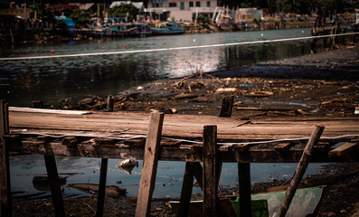 Old rustic wooden bridge across the river