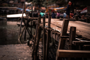Old rustic wooden bridge across the river