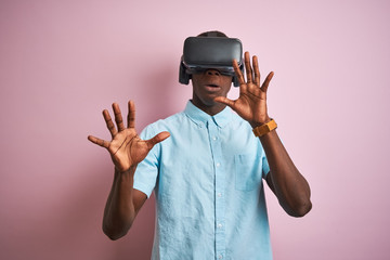 Young african american man playing virtual reality game using goggles