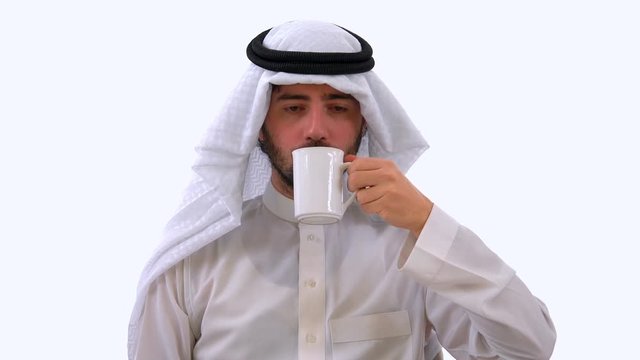 Arabian Man Holding Mug and Drinking Coffee, White Background Studio