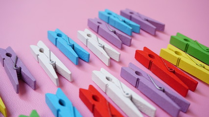 colorful clothes pegs on blue background