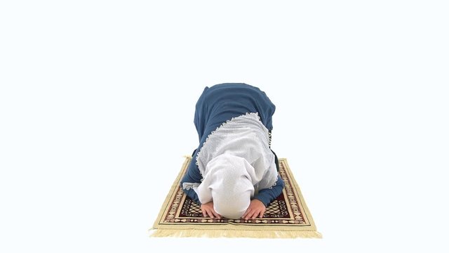 Caucasian Muslim Woman Prostrating and Praying on Carpet, White Background