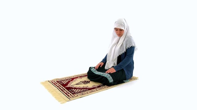 Muslim Woman Wiping Her Palms Over Her Face After Pray