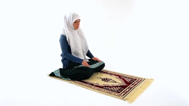 Muslim Girl Praying on Carpet in Namaz on White Background