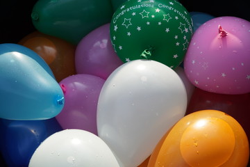 Colorful water balloons in a basket