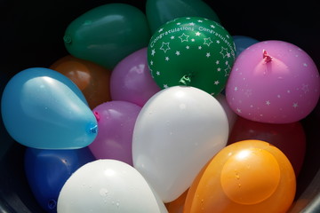 Colorful water balloons in a basket