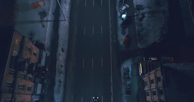 Top down aerial view of night streets in downtown Kyiv, Ukraine, with bright night lighting. Wide shot on dji mavic 2 pro hasselblad camera with smooth cinematic drone motion 