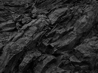 Foto op Aluminium Zwarte rotsachtergrond. Donkergrijze steentextuur. Zwarte grungeachtergrond. Bergclose-up. Verontruste achtergrond. © Наталья Босяк