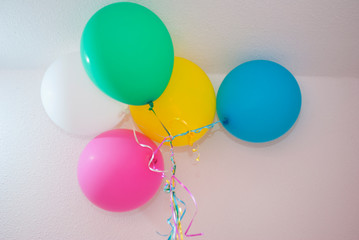group of balloons inflated with helium gas for multicolored children's party, birthday celebration
