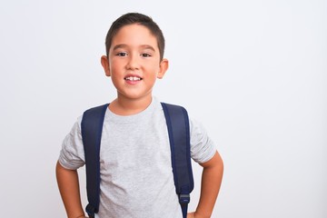 Beautiful student kid boy wearing backpack standing over isolated white background with a happy and...