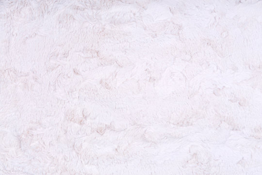 White vegan faux fur texture background. Eco friendly trendy alternative to natural fur. Modern material texture. Eco friendly shopping concept