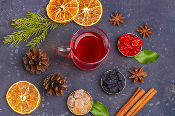 Hot spicy Christmas home made drink. Mulled wine, cranberry punch or Sangria with cranberries and orange for  feast in oriental style. Winter holidays concept. Close up, copy space for text, flat lay