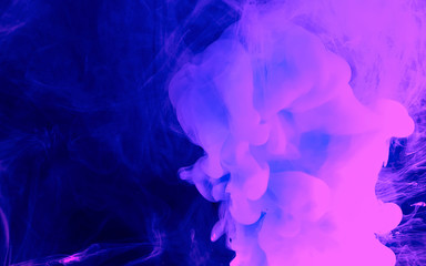 Space phantom blue and purple abstract background. Watercolor ink in water. Cool trending screensaver..