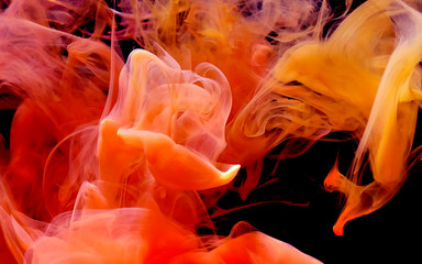 Watercolor ink in water. Cosmic red-yellow-orange abstract background. Cool trending screensaver.