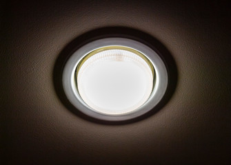 Recessed ceiling led lamp of white light close-up.