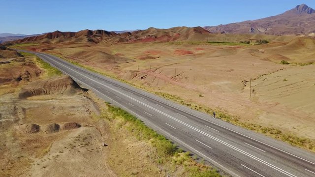 A man walking alone on the higway in Igdir, Turkey