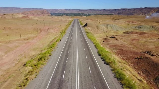 A man walking alone on the higway in Igdir, Turkey