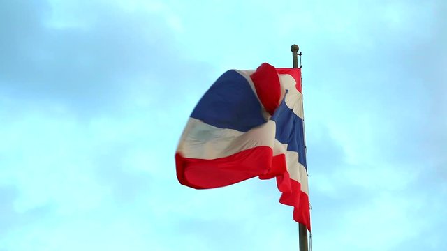 The Thai flag waved with the wind, The meaning of red is the nation, White is religion, Blue is the king monarchy